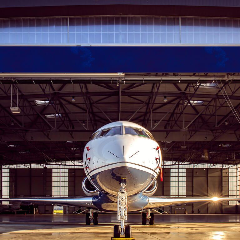 private jet at the exit of the warehouse