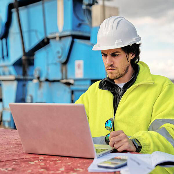 An expert in multimodal transport solutions is seen working on a plan to ship a heavy item